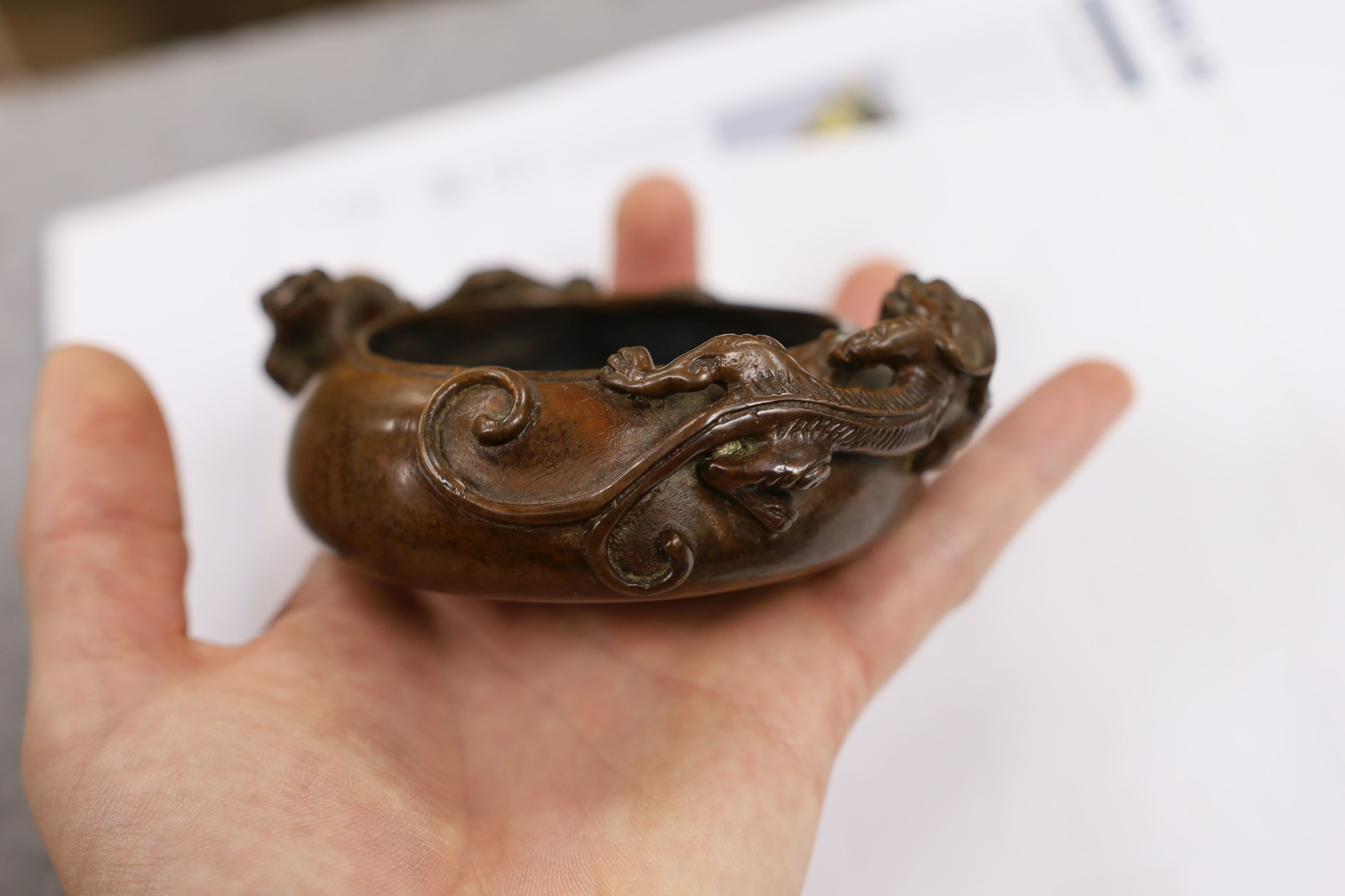 Two Chinese bronze censers, largest 11cms diameter